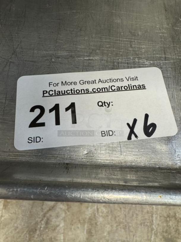 Half size sheet pans for auction, set of 6, used condition. Auction label reads "Qty: x6, SID: 211".