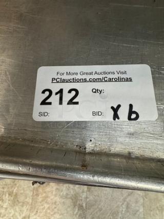 Half-size sheet pans; set of 6. Visible label: Auction ID 212, refers to a larger auction event. Signs of wear present.