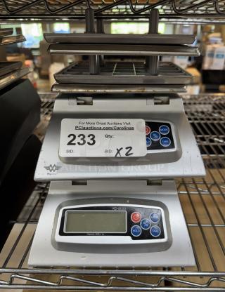 Two Myweigh KB8000 digital scales with LCD display, mode and tare buttons. Used condition with visible wear.