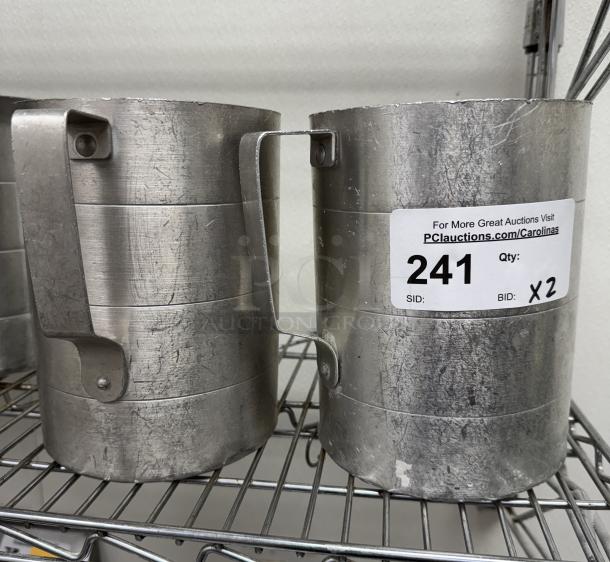 Two metal 4 qt. measuring cups with handles, showing wear. Auction label indicates item number 241, BID X2.