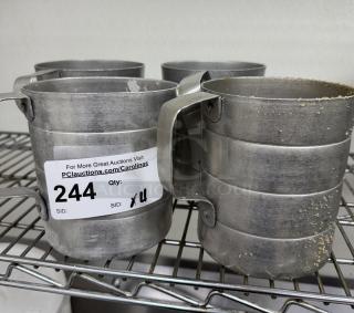 Metal 2 Qt. measuring cups, set of 4, in used condition, with auction label showing item 244.