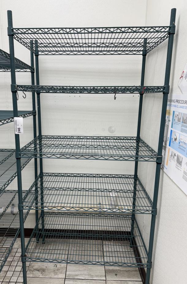 Wire rack with 5 shelves, metal construction, green finish, in good condition. Tag with number 246 visible.