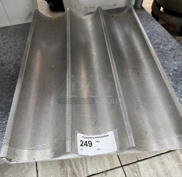 American Industrial perforated bread pan, three loaf capacity, metal, ID label 249, used condition.