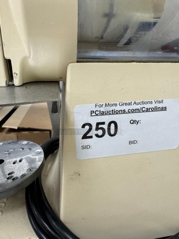Santos Heavy Duty Grater, cream color, visible wear, power cord shown; auction label with lot number 250 present.