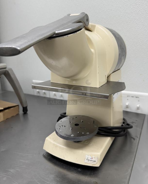 Santos Heavy Duty Grater in used condition, cream color, metallic components, visible power cord, suitable for commercial use.