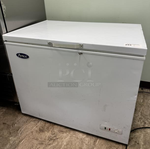 Atqsa chest freezer, white, tested and working. Features a metal handle, visible Atqsa logo, minor surface wear.
