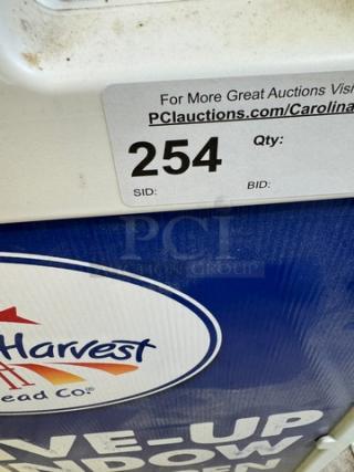 Signicade Customizable Deluxe Portable Advertising Sign, showing Harvest Bread Co logo and auction tag indicating lot 254.