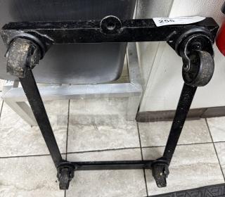 Full size sheet pan dollie with four castor wheels, black metal frame, some wear visible. Auction tag labeled "255."
