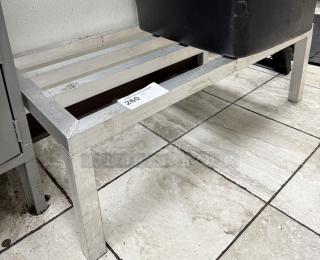Metal dunnage rack with slatted top, in used condition. Auction label indicates item number 260.
