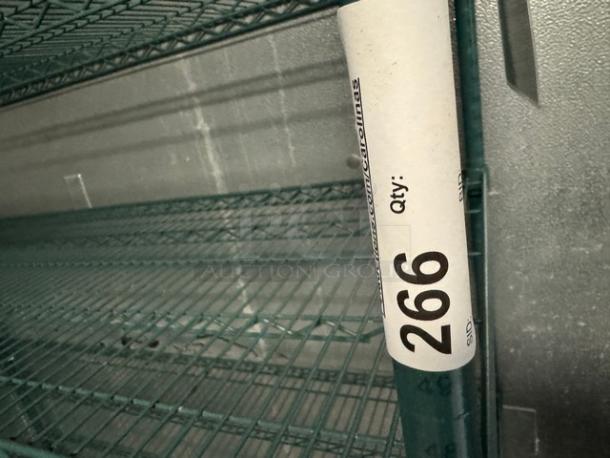 Wire rack with 5 shelves, green, metal construction. Tag shows "Qty: 266." Good condition. Suitable for storage.