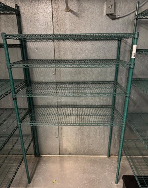 Green wire rack with 4 shelves, metal construction, adjustable height, used condition, suitable for storage or display.