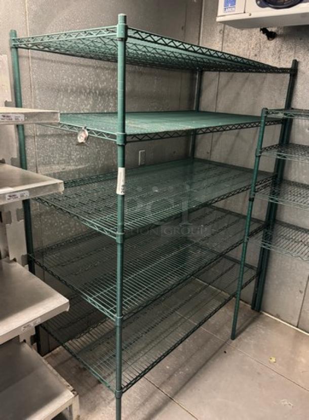 Green wire rack with five shelves, used condition, durable metal construction, adjustable shelf heights, ideal for storage.