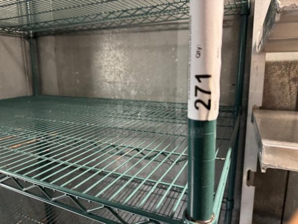 Green wire rack with four shelves, metal construction. Tag marked "271" on vertical support. Used, good condition.