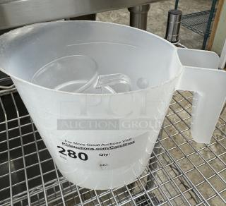 Three assorted measuring cups, large translucent plastic with handle, visible auction label bearing "280" in black text.