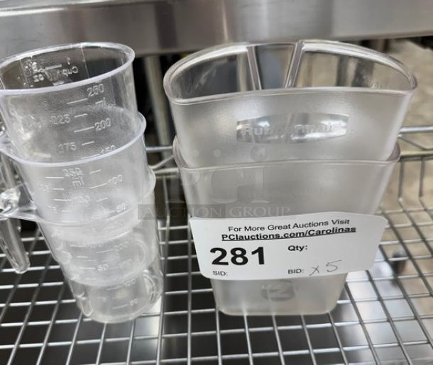 Assorted measuring cups; 2 two-cup and 3 one-cup sizes. Clear plastic with visible measurement markings. Auction ID: 281.