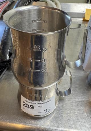 Stainless steel 32 oz measuring cups with embossed markings, set of 2, auction label marked "289, Qty: X2."