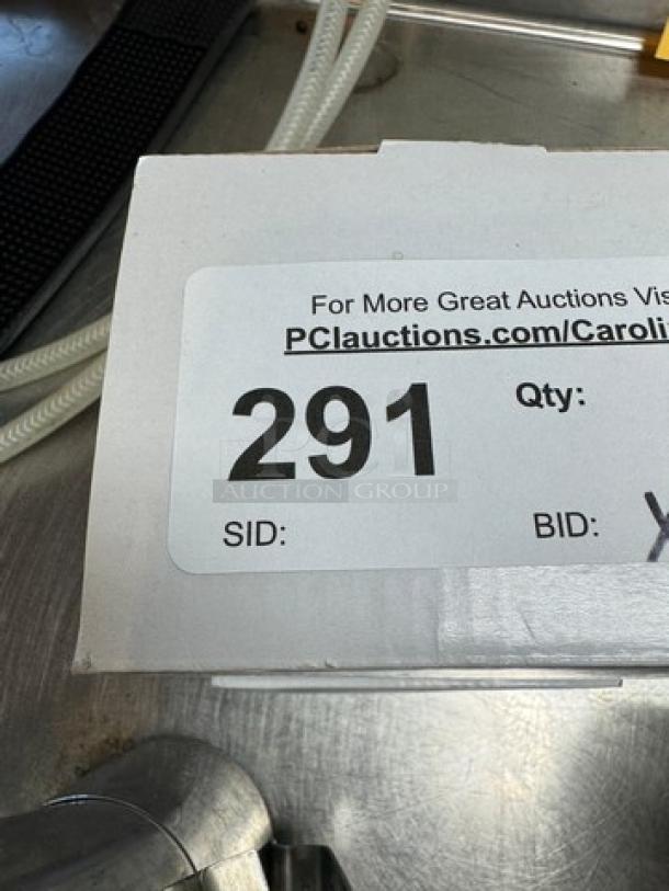 Box of 20 oz. frothing pitchers, five total, with two new in box. Label shows auction details and quantity.