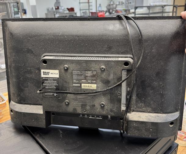 Insignia 25" monitor, tested and working, with various ports visible. Slight dust, back panel shown with recycle label.