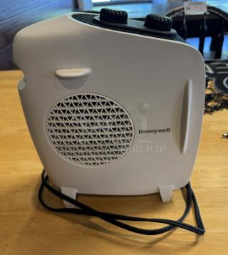 Honeywell portable heater, white with black dials, tested and working, good condition, visible Honeywell logo.