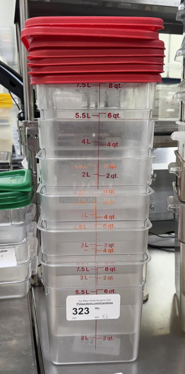 Stack of six 8 qt. square containers with red lids, marked in quarts and liters; auction tag indicates item 323, bid x6.