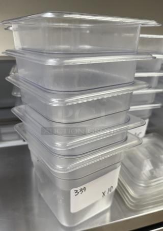 Stack of 10 Vigor acrylic pans, 1/3 x 6 size, clear, labeled with "339 x10." New condition, ideal for food storage.