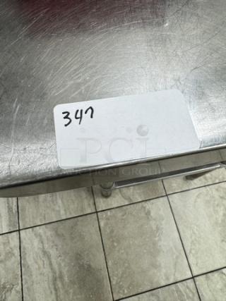 Stainless steel table with undershelf, includes Edlund #10 can opener, visible label reads "347", used condition.