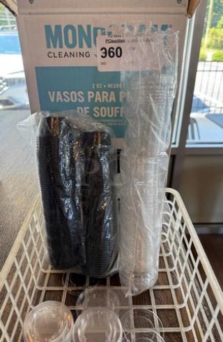 New 2oz portion cups with lids in black and clear, packed in original Monogram box, 1 case, unopened.