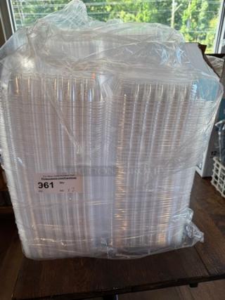 Clear plastic takeout trays, bulk stack, wrapped in plastic. Label shows: "361, Qty: 2 x.".