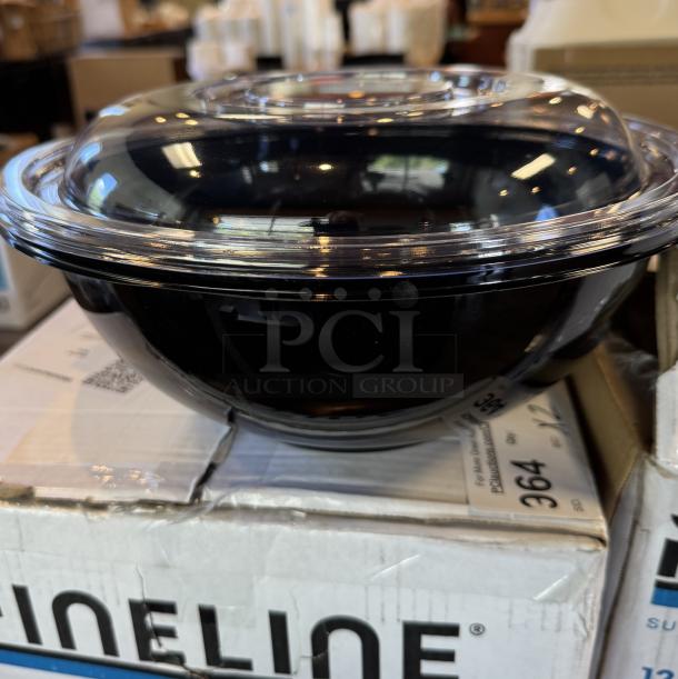Disposable 12" salad bowl with clear lid, black base, new condition, on top of box with product details visible.