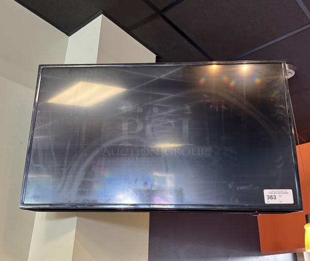 Samsung 48" TV with wall mount and remote, tested and working. Visible sticker with label "383".