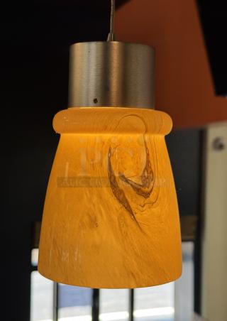 Amber glass pendant light with metal fixture, 4.5" x 7", textured swirl design, excellent condition.