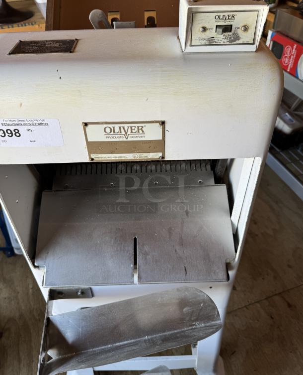Oliver 797-32 Gravity Feed Bakery Bread Slicer on casters, tested and working, features slicing blades, ON/OFF switch, and Oliver branding.