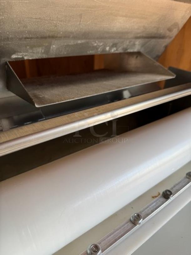 Somerset Dough Roller, metal and plastic, tested and working, industrial-grade, used condition, close-up of rollers and chute.