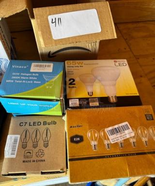 Assorted light bulbs, including Vinaco GU10 Halogen, EcoSmart LED 65W, C7 LED, and Ascher E26 decorative bulbs. Boxes shown.