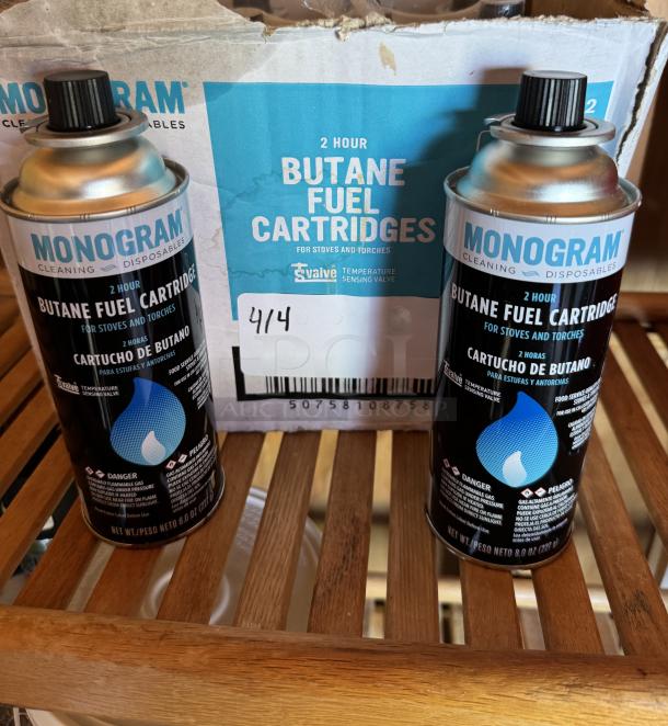 Monogram 2-hour butane fuel cartridges for stoves and torches, 10-pack. Includes a box and visible labels; condition appears new.