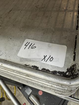 Set of full-size sheet pans, quantity 10. Visible wear and scratches, label "416 x10" indicates set size.