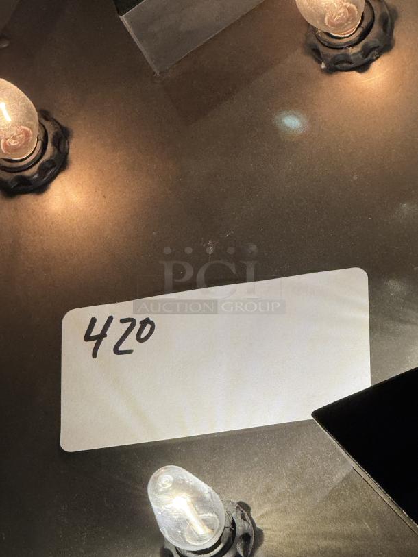 Full size sheet pans, nine pieces. Image shows a lighting setup with bulbs and a card labeled "420."