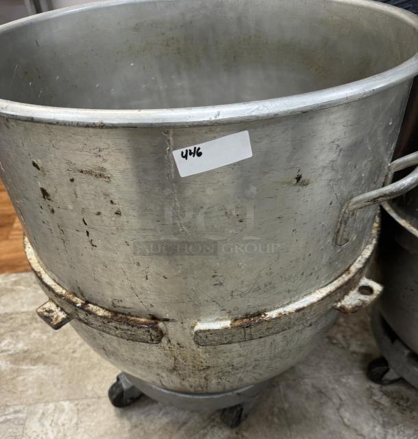 140 Qt. mixing bowl with dollie, stainless steel, showing signs of wear and rust, with a visible label marked "446."
