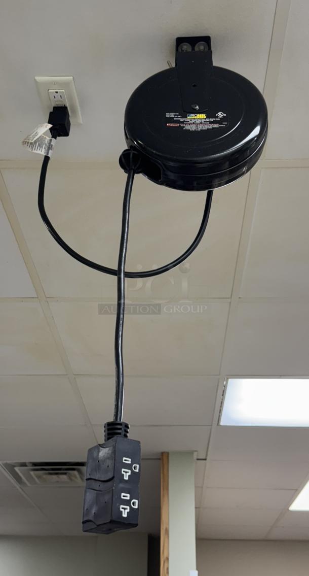 Pro Reel Ceiling Drop Cord with retractable design, black casing, three-outlet connector, mounted on ceiling for convenient access.