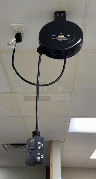 Pro Reel Ceiling Drop Cord with retractable design, black casing, three-outlet connector, mounted on ceiling for convenient access.