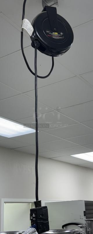 Pro Reel Ceiling Drop Cord in black, ceiling-mounted with retractable cable and plug, excellent condition.