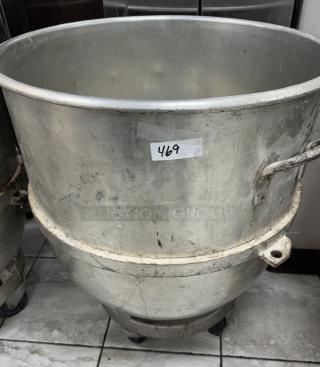 140 Qt. metal mixing bowl with dollie, showing wear. Label reads "469." Ideal for commercial kitchens.