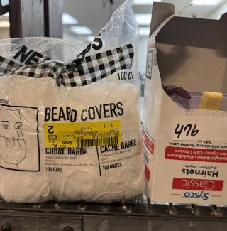 Package of 100 beard covers and box of hair nets. Beard covers are polypropylene, non-woven, white. Hair nets by SySCO, labeled size 476.