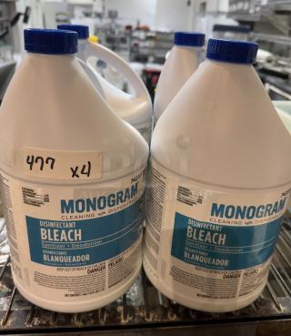 Monogram 1 Gal Bleach bottles, set of four. Label indicates disinfectant, sanitizer, and deodorizer. Blue cap, sealed condition.