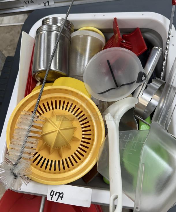 Assorted kitchen utensils with collapsible dish racks; includes citrus squeezer, brush, metal canisters; item number 479.