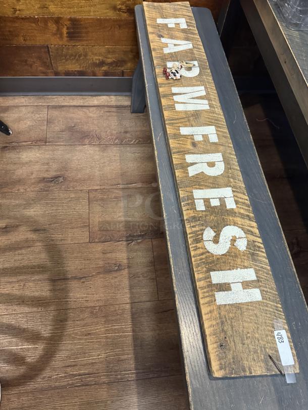 "Farm Fresh" wooden sign with distressed finish, rustic appeal; tag labeled "483." Ideal for decor or collection.
