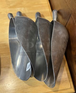 Set of four metal scoops, one 38 oz and three 58 oz, slightly worn, number label 498 visible.