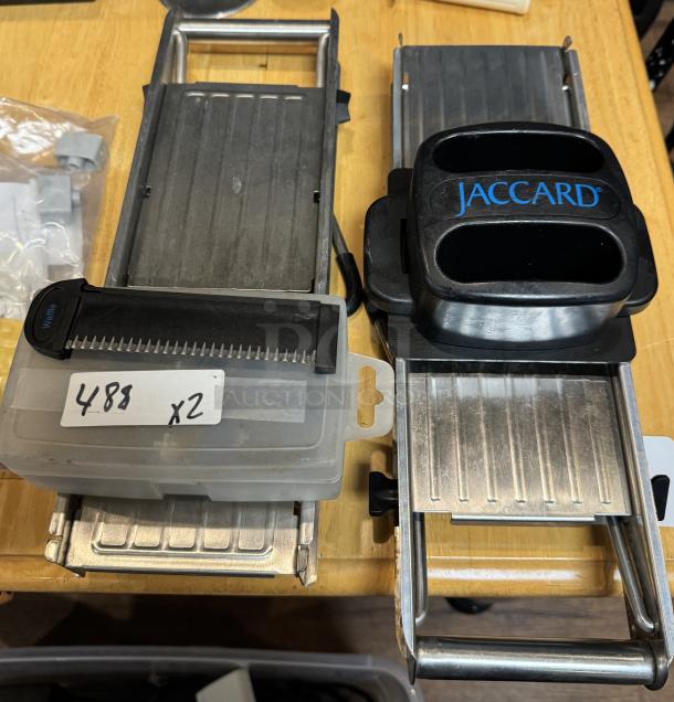 Jaccard mandolin slicer set with attachments. Includes two slicers, visible brand marking, and additional parts. Appears gently used.