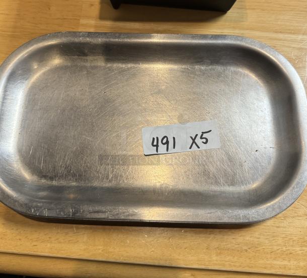 Metal serving tray with scuff marks, rectangular shape, tag reads "491 x5," indicating a set of five trays.