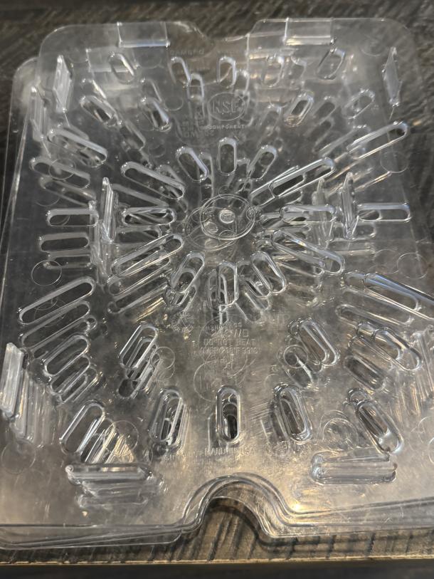 Clear Cambro pan insert 20CWD, with NSF marking, durable plastic, transparent design for kitchen use, new condition.